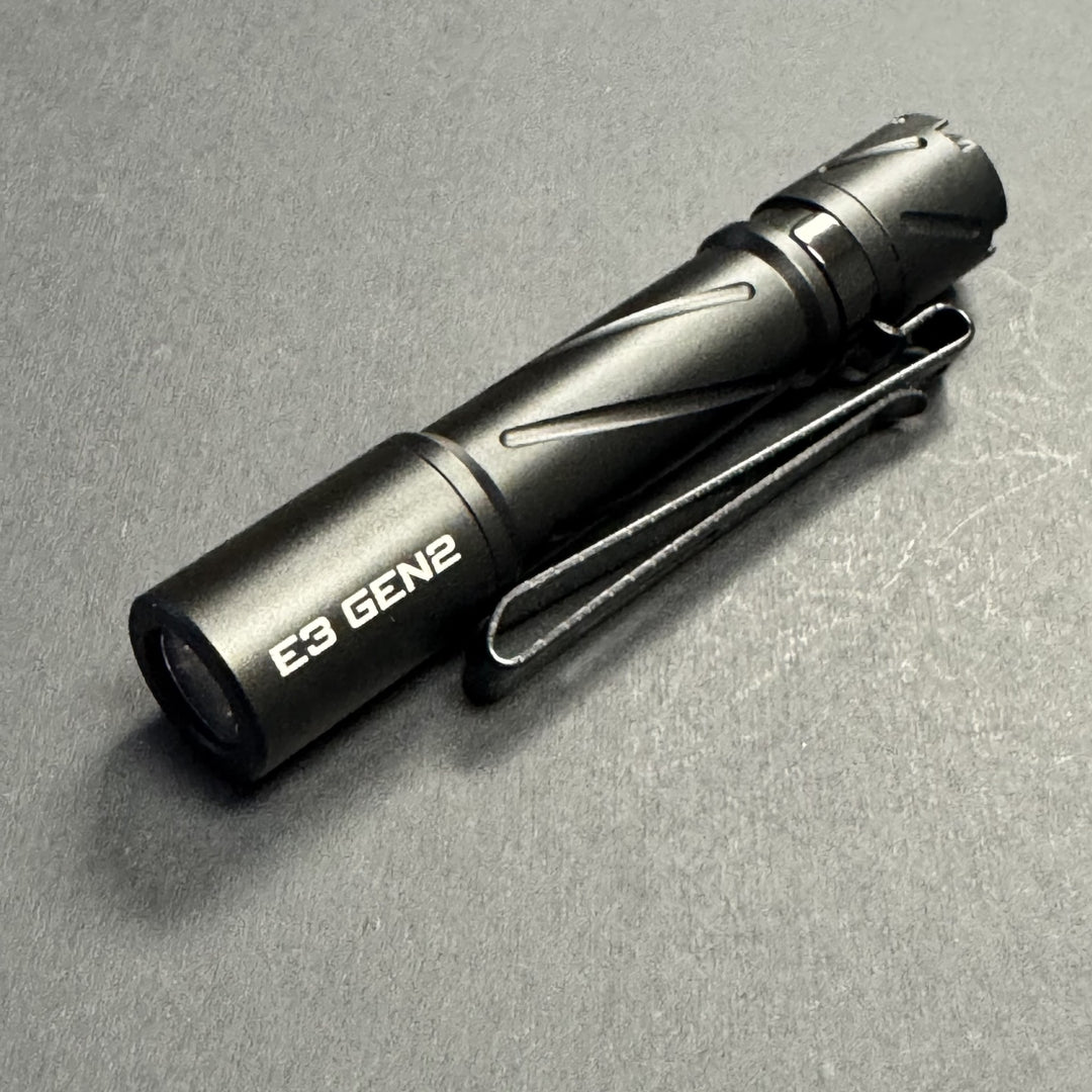 Black Powertac E3 GEN2 flashlight turned off, showing E3 GEN2 head marking and pocket clip
